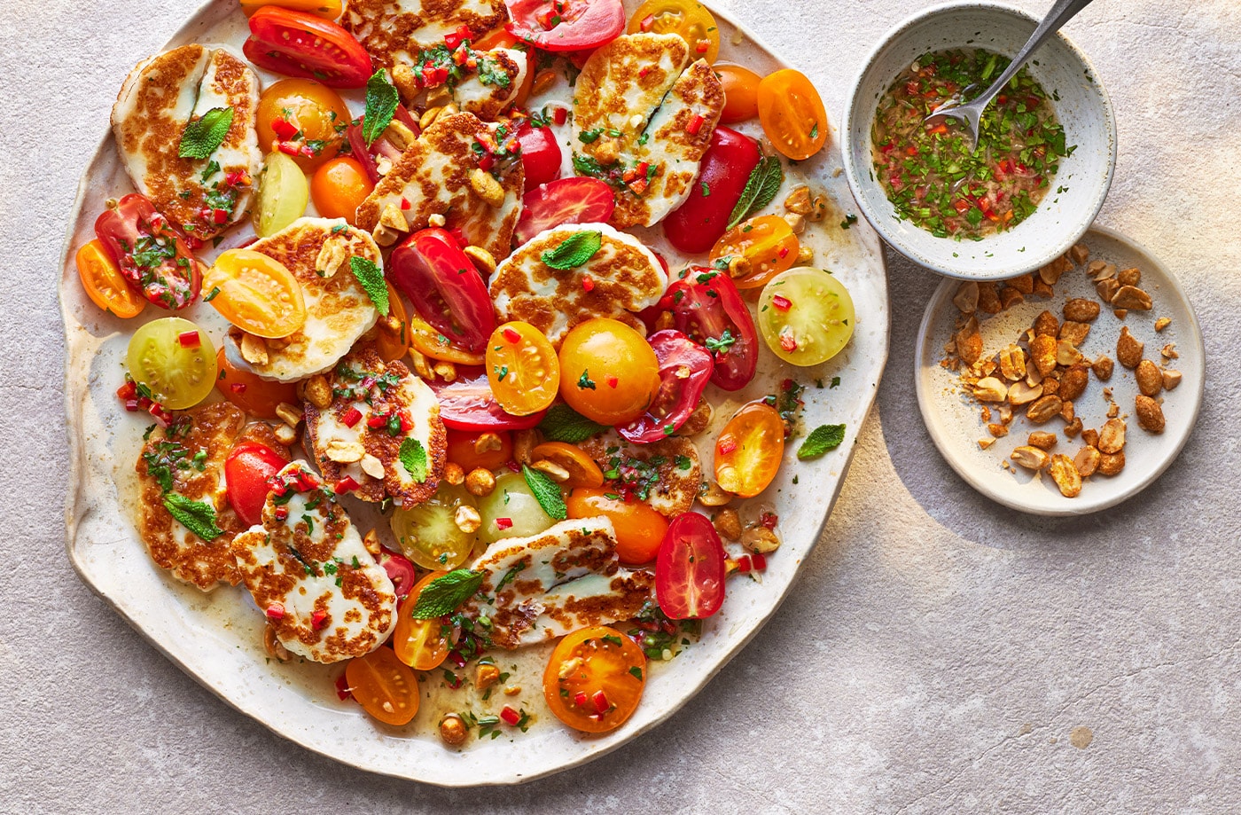 Thai-inspired tomato and halloumi salad
