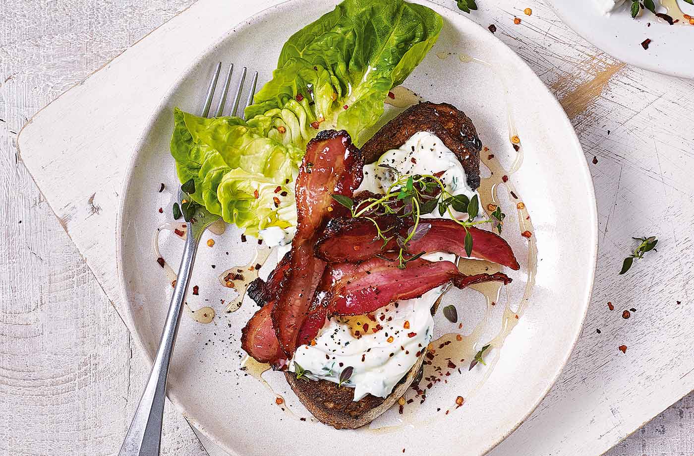 Soft cheese and bacon on toast