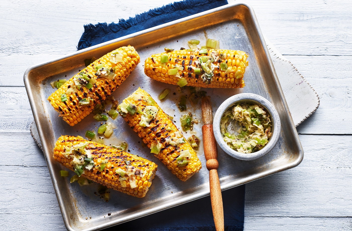 Corn on the cob with charred spring onion butter