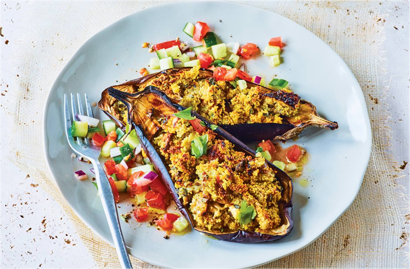 Stuffed aubergines with cucumber and tomato salad