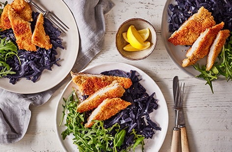 Image of "Couscous chicken schnitzel with red cabbage and rocket"