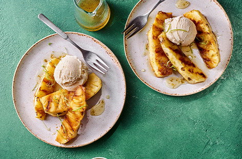 Grilled pineapple with rum-spiked lime syrup