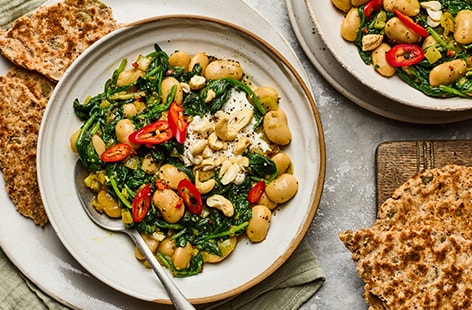 Image of "Saag aloo-style butter beans with flatbreads"