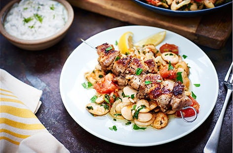 Image of "Pork souvlaki with Greek-style butter beans"