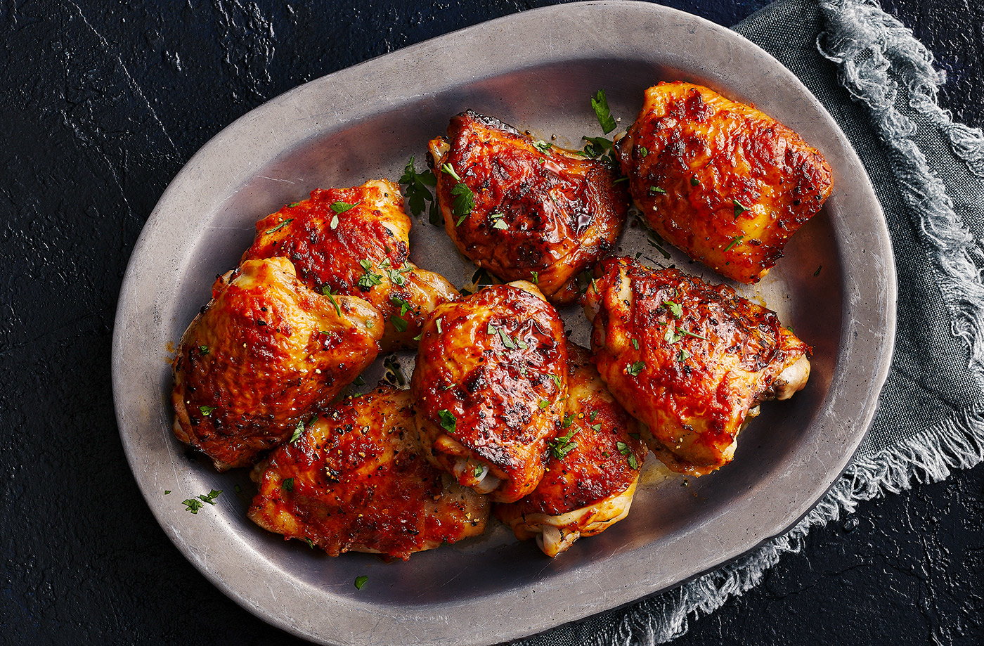Sticky honey, garlic and harissa chicken thighs