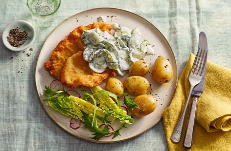 Image of "Czech-inspired chicken schnitzel with warm potato salad"
