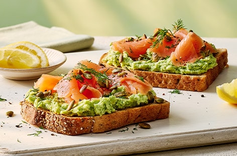 Smashed soya beans and salmon on toast