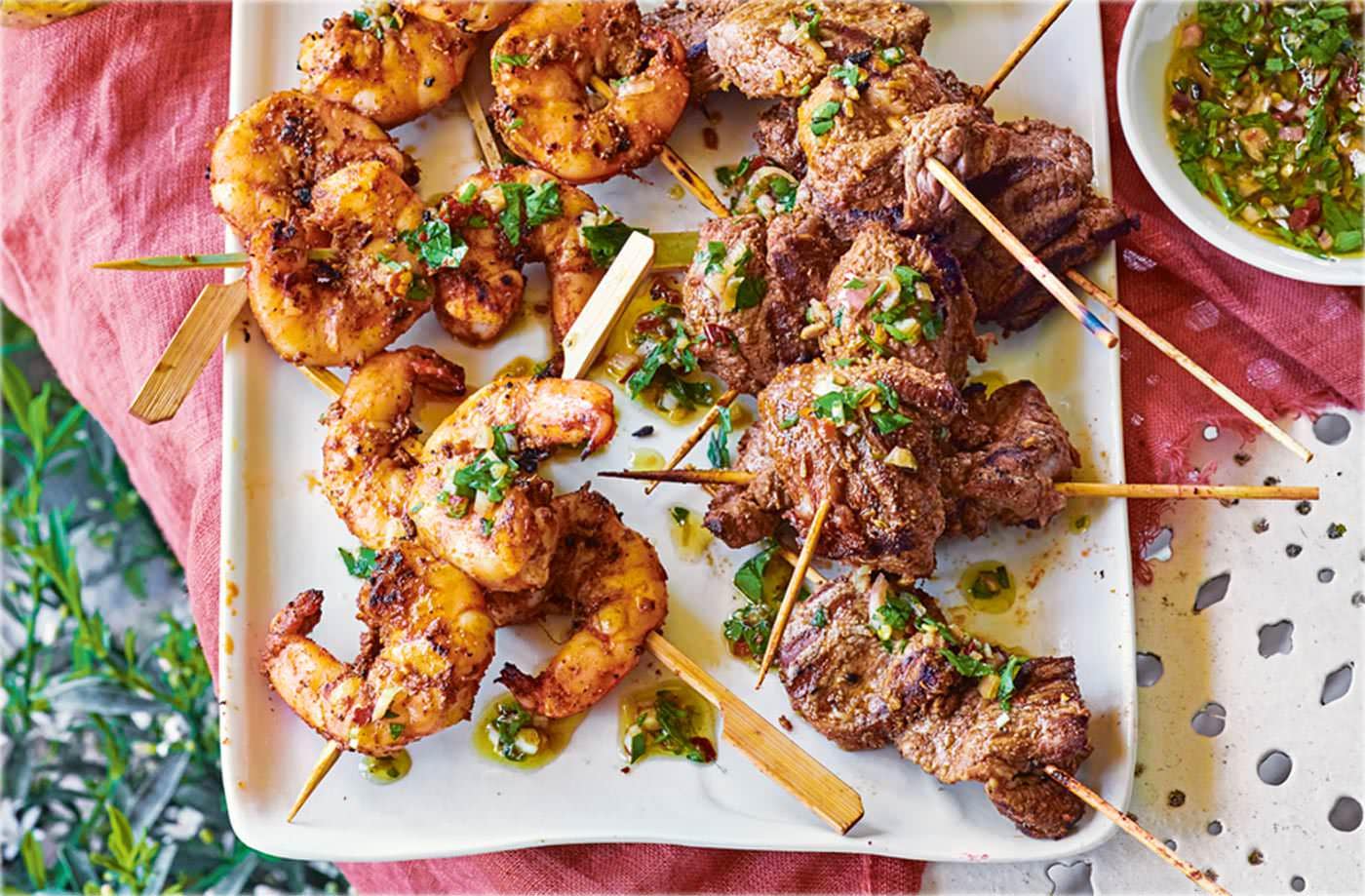 Smoky skewers with parsley dipping sauce