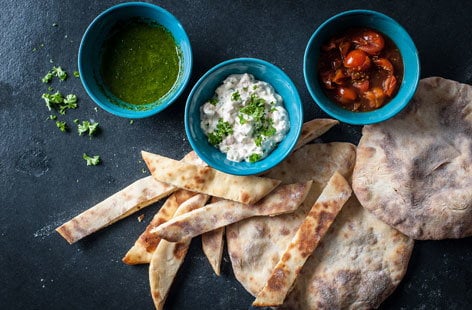 Image of "Adam Gray's flatbread soldiers with dips"